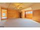 Spacious bonus room features wood-paneled walls and access to another room at 1051 Lake Rutledge Rd, Rutledge, GA 30663