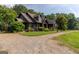 Charming home featuring a well-manicured lawn and a gravel driveway at 1051 Lake Rutledge Rd, Rutledge, GA 30663