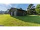 Two car log cabin garage with green grass and a wooden fence at 1051 Lake Rutledge Rd, Rutledge, GA 30663