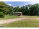 Large garage with multiple bays, offering ample space for vehicles and storage at 1051 Lake Rutledge Rd, Rutledge, GA 30663