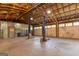 Spacious garage with vehicle lift and ample lighting at 1051 Lake Rutledge Rd, Rutledge, GA 30663