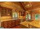 Beautiful kitchen area featuring granite countertops, stainless appliances, custom wood cabinets, and a large window view at 1051 Lake Rutledge Rd, Rutledge, GA 30663