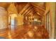 Expansive living space with wood paneled walls and ceilings, connecting the kitchen and living room at 1051 Lake Rutledge Rd, Rutledge, GA 30663