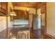 This wood-paneled office features custom cabinets and gleaming wood floors, adding a warm touch at 1051 Lake Rutledge Rd, Rutledge, GA 30663