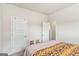 Comfortable bedroom featuring carpet, warm lighting, and a doorway with an open door at 2384 Hastings Manor Ln, Hampton, GA 30228