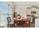 Eat-in kitchen/dining room offers round table and additional seating at kitchen island at 2384 Hastings Manor Ln, Hampton, GA 30228