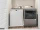 Laundry room featuring a white Maytag washing machine and a grey dryer at 2384 Hastings Manor Ln, Hampton, GA 30228