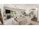 Bright living room flows into dining room and kitchen with lots of seating and natural light at 2384 Hastings Manor Ln, Hampton, GA 30228
