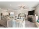 Bright living room flows into dining room with lots of seating, fresh paint and stylish decor at 2384 Hastings Manor Ln, Hampton, GA 30228