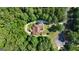 Aerial view of the property showcasing the house and surrounding trees at 285 Acton Dr, Fayetteville, GA 30215