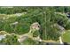 Aerial view of a wooded 2.06 acre lot featuring a brick home with a circular driveway at 285 Acton Dr, Fayetteville, GA 30215