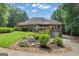 Beautiful backyard showcasing mature landscaping and a well-maintained lawn at 285 Acton Dr, Fayetteville, GA 30215