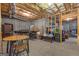 Unfinished basement featuring exposed ceilings, brick walls and a table with chairs at 285 Acton Dr, Fayetteville, GA 30215