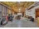 Unfinished basement featuring exposed ceilings, concrete floors, and an array of tools and equipment at 285 Acton Dr, Fayetteville, GA 30215