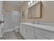 Bathroom featuring a large vanity, shower and medicine cabinet, providing ample storage and convenience at 285 Acton Dr, Fayetteville, GA 30215