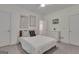 Bright bedroom with modern furnishings, a soft-colored bed, and a view into the bathroom at 285 Acton Dr, Fayetteville, GA 30215