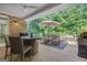 Relaxing deck with outdoor dining area and lush green surroundings, perfect for enjoying meals outside at 285 Acton Dr, Fayetteville, GA 30215