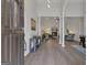 Open foyer with high ceilings, elegant columns, and a view into the spacious living area with hardwood floors at 285 Acton Dr, Fayetteville, GA 30215