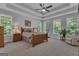 Spacious main bedroom with tray ceilings, large windows, and natural light filling the space at 285 Acton Dr, Fayetteville, GA 30215