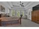Comfortable main bedroom featuring tray ceiling, generous natural light, and serene views at 285 Acton Dr, Fayetteville, GA 30215