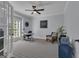 Bright home office with a ceiling fan, a large window, and a modern desk and chair set at 285 Acton Dr, Fayetteville, GA 30215