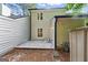 View of the rear exterior with a concrete patio, siding and windows at 398 Patrick Henry Ct, Riverdale, GA 30274