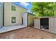 Backyard featuring an outdoor storage shed, concrete patio, and partial privacy fence at 398 Patrick Henry Ct, Riverdale, GA 30274