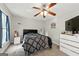 Bedroom featuring a ceiling fan, plush carpet, a window, and plenty of space for personalization at 398 Patrick Henry Ct, Riverdale, GA 30274