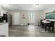 Bright kitchen features stainless steel appliances and adjacent dining area at 398 Patrick Henry Ct, Riverdale, GA 30274