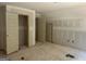 Unfinished bedroom with unfinished flooring, doors, and natural light at 5555 Hwy 155 N, Stockbridge, GA 30281