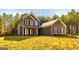Charming two-story home featuring gray siding and black shutters, complemented by a well-manicured lawn at 5555 Hwy 155 N, Stockbridge, GA 30281