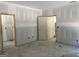 Unfinished room with bare walls and open doorways, offering an ideal space to create your dream design at 5555 Hwy 155 N, Stockbridge, GA 30281