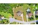 Aerial view of home with spacious yard, mature landscaping, swimming pool and serene neighborhood setting at 195 Berry Hill Ln, Tyrone, GA 30290