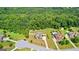 Aerial view of the home, showcasing a large lot with mature trees, lush landscaping and quiet neighborhood at 195 Berry Hill Ln, Tyrone, GA 30290