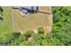 Large backyard featuring a patio area, lush lawn, and mature trees creating a private oasis at 195 Berry Hill Ln, Tyrone, GA 30290