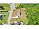 Aerial view of the home, surrounded by lush greenery, landscaped yard and serene neighborhood at 195 Berry Hill Ln, Tyrone, GA 30290
