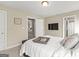 Bedroom featuring a television, and an adjacent room visible through the doorway at 195 Berry Hill Ln, Tyrone, GA 30290