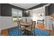 Bright dining room featuring a modern light fixture, wainscoting detail, and stylish decor at 195 Berry Hill Ln, Tyrone, GA 30290