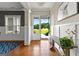 Inviting foyer with hardwood floors, wainscoting, and a view of the outdoors through the open front door at 195 Berry Hill Ln, Tyrone, GA 30290