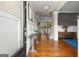 Elegant foyer with hardwood floors, wainscoting, coffered ceilings, and a view into the open-concept living space at 195 Berry Hill Ln, Tyrone, GA 30290