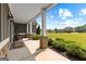 Welcoming front porch with stone pillars, ample seating, and a picturesque view of the neighborhood at 195 Berry Hill Ln, Tyrone, GA 30290