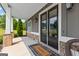 Inviting front porch featuring stone accents, stylish welcome mat, and a cozy seating area with a view at 195 Berry Hill Ln, Tyrone, GA 30290