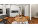 Eat-in kitchen includes stainless steel appliances, granite countertops, and hardwood floors at 195 Berry Hill Ln, Tyrone, GA 30290