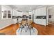 Bright kitchen featuring white cabinets, a dark backsplash, and a central island at 195 Berry Hill Ln, Tyrone, GA 30290
