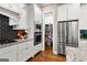 Modern kitchen with stainless steel appliances, pantry and beautiful hardwood floors at 195 Berry Hill Ln, Tyrone, GA 30290