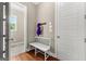 Mudroom featuring a white bench, coat rack, and view of the backyard at 195 Berry Hill Ln, Tyrone, GA 30290