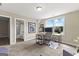 Office with neutral carpet, large window, a desk, and view of an en suite bathroom at 195 Berry Hill Ln, Tyrone, GA 30290