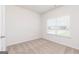 Bedroom with light colored walls, neutral carpet, and blinds on the window at 1512 Big Bud Ln, Locust Grove, GA 30248