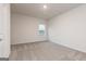 Large, bright bedroom with carpet and a view from the window at 1512 Big Bud Ln, Locust Grove, GA 30248