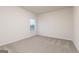Bright bedroom with neutral carpet and a window allowing ample natural light at 1512 Big Bud Ln, Locust Grove, GA 30248